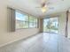 Bright sunroom with tile floors and backyard access at 3276 Westford Ln, #117,, Sarasota, FL 34231