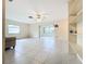 Large living room with tile floors and built-in shelving at 3276 Westford Ln, #117,, Sarasota, FL 34231