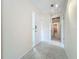 Hallway with tile floors, leading to bedrooms and a bathroom at 3276 Westford Ln, #117,, Sarasota, FL 34231