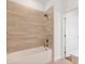 Stylish bathroom with modern tub, rain shower head, and ceramic tile at 1625 Compass Pointe Ct # 105, Punta Gorda, FL 33950