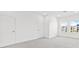 Neutral bedroom with white walls and doors, gray carpet, and natural light at 1625 Compass Pointe Ct # 105, Punta Gorda, FL 33950