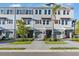 Beautiful townhome exteriors showcasing a modern facade, complemented by well-manicured landscaping and inviting entrances at 1625 Compass Pointe Ct # 105, Punta Gorda, FL 33950