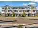 Beautiful row of new construction townhouses featuring uniform design, neat landscaping, and modern curb appeal at 1625 Compass Pointe Ct # 105, Punta Gorda, FL 33950
