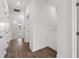 Hallway displaying wooden flooring, white walls, and ample closet space at 1625 Compass Pointe Ct # 105, Punta Gorda, FL 33950