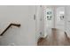 Hallway showing modern trim, a white door and wooden flooring at 1625 Compass Pointe Ct # 105, Punta Gorda, FL 33950