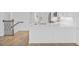 Kitchen island with white countertop and sink, complemented by stainless steel appliances and natural light from nearby windows at 1625 Compass Pointe Ct # 105, Punta Gorda, FL 33950