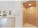 Modern elevator next to a bright, open living space with wood floors and a balcony providing scenic views at 1625 Compass Pointe Ct # 105, Punta Gorda, FL 33950