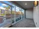 Private outdoor patio with stylish brick flooring and views of the lush landscaping and nearby buildings at 1625 Compass Pointe Ct # 105, Punta Gorda, FL 33950