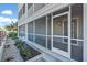 This covered, screened-in patio offers a tranquil outdoor retreat with stone pavers and manicured landscaping at 1625 Compass Pointe Ct # 105, Punta Gorda, FL 33950