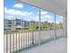 Spacious screened balcony with views of a street and community, perfect for outdoor living at 1625 Compass Pointe Ct # 105, Punta Gorda, FL 33950