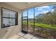 Screened porch with a view of a lake and lush landscaping at 16706 Vardon Ter # 107, Bradenton, FL 34211