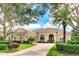 Beautiful single-story home with tile roof, manicured landscaping and brick driveway at 3342 Founders Club Dr, Sarasota, FL 34240