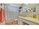 Clean bathroom with shower/tub combo and coastal decor at 4380 Exeter Dr # 303, Longboat Key, FL 34228