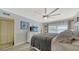 Bright bedroom featuring a ceiling fan, a comfortable bed, and plenty of natural light at 4380 Exeter Dr # 303, Longboat Key, FL 34228