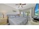 Bright bedroom with a comfortable bed and plenty of closet space at 4380 Exeter Dr # 303, Longboat Key, FL 34228