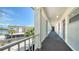 Bright condo hallway with exterior views and access to units at 4380 Exeter Dr # 303, Longboat Key, FL 34228