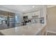 Modern kitchen featuring stainless steel appliances and white cabinetry at 4380 Exeter Dr # 303, Longboat Key, FL 34228