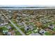 Aerial view showcases a charming neighborhood with tree-lined streets, well-maintained lawns, and inviting homes at 5819 2Nd Avenue Nw Dr, Bradenton, FL 34209