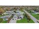 Home aerial view featuring a lush lawn, mature landscaping, and a welcoming facade at 5819 2Nd Avenue Nw Dr, Bradenton, FL 34209