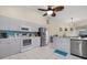 Modern kitchen featuring stainless steel appliances and light gray cabinetry at 5819 2Nd Avenue Nw Dr, Bradenton, FL 34209