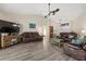 Open living room with comfortable seating and large TV at 5819 2Nd Avenue Nw Dr, Bradenton, FL 34209