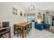 Casual dining area with rustic wood table and teal chairs at 5819 2Nd Avenue Nw Dr, Bradenton, FL 34209