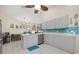 Modern kitchen with stainless steel appliances and teal backsplash at 5819 2Nd Avenue Nw Dr, Bradenton, FL 34209