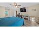 Bedroom with teal bedding and a view into the bathroom at 5819 2Nd Avenue Nw Dr, Bradenton, FL 34209