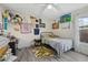 Cozy bedroom featuring a twin bed, a desk, and a vibrant rug at 5819 2Nd Avenue Nw Dr, Bradenton, FL 34209