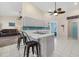 Updated kitchen with breakfast bar and teal accents at 5819 2Nd Avenue Nw Dr, Bradenton, FL 34209