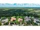 Aerial view of a luxury home with pool and lush landscaping in a gated community at 3342 Founders Club Dr, Sarasota, FL 34240