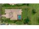 Aerial view showcasing home's layout, pool, and surrounding landscape at 3342 Founders Club Dr, Sarasota, FL 34240