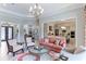 Open concept living room with views into the kitchen and formal dining area at 3342 Founders Club Dr, Sarasota, FL 34240