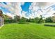 Large fenced backyard with well-maintained lawn at 3342 Founders Club Dr, Sarasota, FL 34240