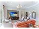 Open living area showcasing a coral sofa and stunning views of the backyard at 3342 Founders Club Dr, Sarasota, FL 34240