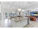 Open concept kitchen with granite island, stainless steel appliances, and breakfast nook at 3342 Founders Club Dr, Sarasota, FL 34240