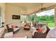 Relaxing covered patio with wicker furniture and outdoor seating at 3342 Founders Club Dr, Sarasota, FL 34240