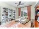 Bright home office with built-in bookshelves and comfortable seating at 3342 Founders Club Dr, Sarasota, FL 34240