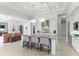 Open concept kitchen with large island and views into the living area at 3342 Founders Club Dr, Sarasota, FL 34240