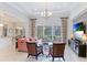 Spacious living room featuring comfortable seating, large TV, and access to backyard at 3342 Founders Club Dr, Sarasota, FL 34240