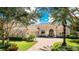 Stunning two-story house with a brick driveway at 3342 Founders Club Dr, Sarasota, FL 34240