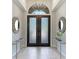 Elegant entryway with double doors and mirrors at 3342 Founders Club Dr, Sarasota, FL 34240