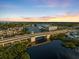 Aerial view of a coastal community with bridge and waterfront property at 1365 Sussex Rd, Venice, FL 34293