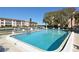 Community pool with water and patio at 4380 Exeter Dr # 303, Longboat Key, FL 34228