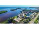 Aerial view of waterfront community with pool and boat slips at 4380 Exeter Dr # 303, Longboat Key, FL 34228