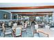 Community dining room with tables and chairs at 4380 Exeter Dr # 303, Longboat Key, FL 34228