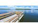 Private wooden dock with bench overlooking the water at 4380 Exeter Dr # 303, Longboat Key, FL 34228