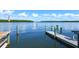 View of the water with a dock, mangroves, and blue sky at 4380 Exeter Dr # 303, Longboat Key, FL 34228