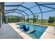 Screened-in pool with a view of the golf course at 24252 Gallberry Dr, Venice, FL 34293