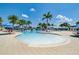 Large community pool with a leisure pool and plenty of lounge chairs at 24252 Gallberry Dr, Venice, FL 34293